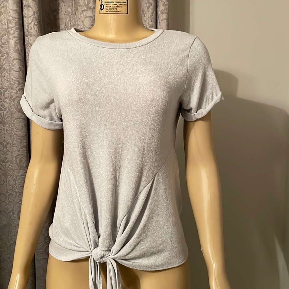 NWT - polyester and rayon. Beautiful light blue color and super soft.